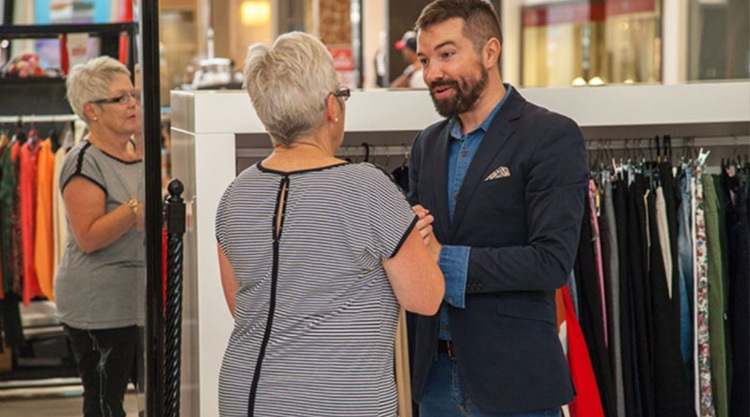 Luke Bettesworth personal shopping with a client in an Auckland boutique